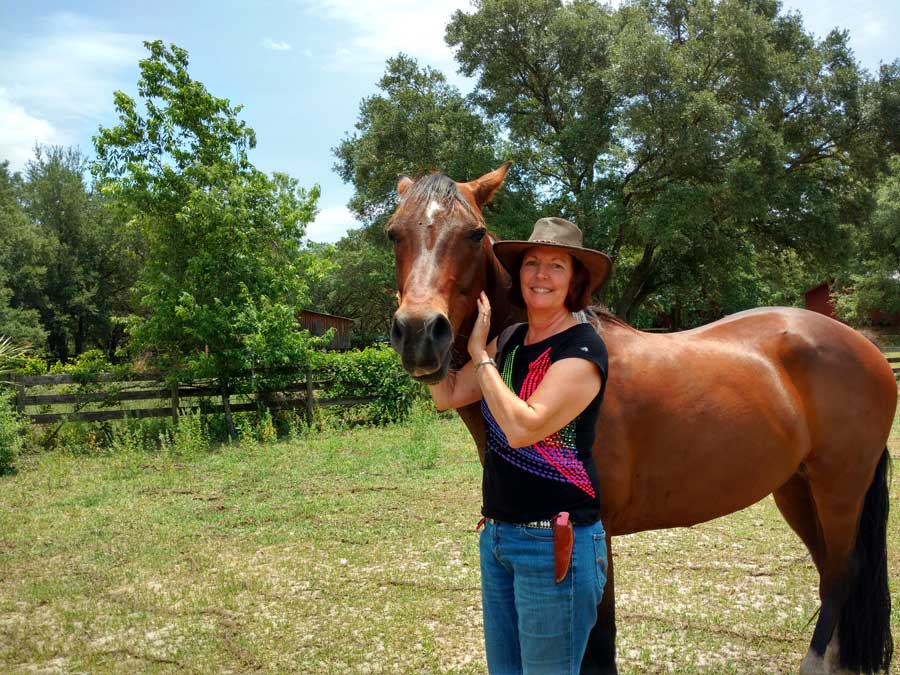 CODE H.O.R.S.E. owner Cher Myers and one of her therapy horses.