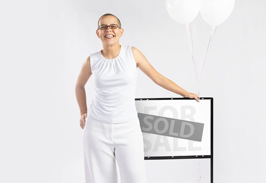 Connie-Mahan-Realty-in-front-of-SOLD-sign